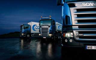 http://cargo.bold-themes.com/transport-company/wp-content/uploads/sites/2/2015/09/Three-trucks-on-blue-background-320x200.jpg